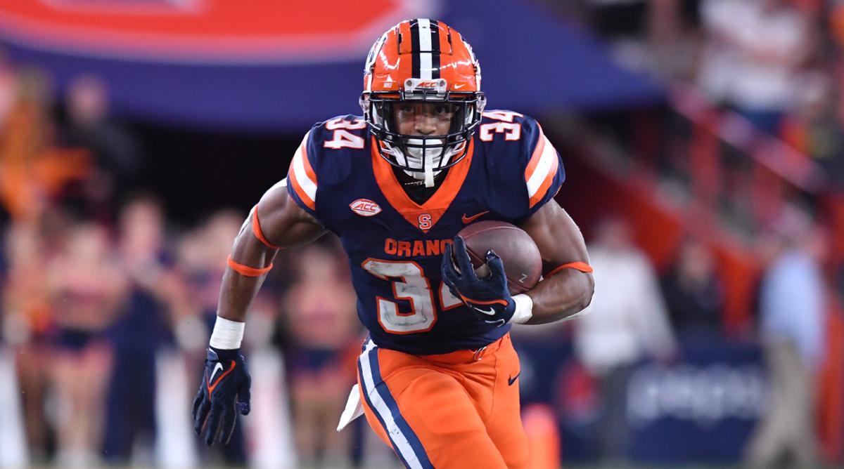 Oct 15, 2022; Syracuse, New York, USA; Syracuse Orange running back Sean Tucker (34) runs for a touchdown against the North Carolina State Wolfpack in the fourth quarter at JMA Wireless Dome.